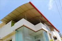 Roof-Semi arch<br/> Truss-Twin 2 inch round with Cross-vertical reinforcements<br/> Sheet-Autumn red Gal aluminium Industrial Corrugation Sheet<br/>Gutter- Boxed Gal aluminium Plain sheet